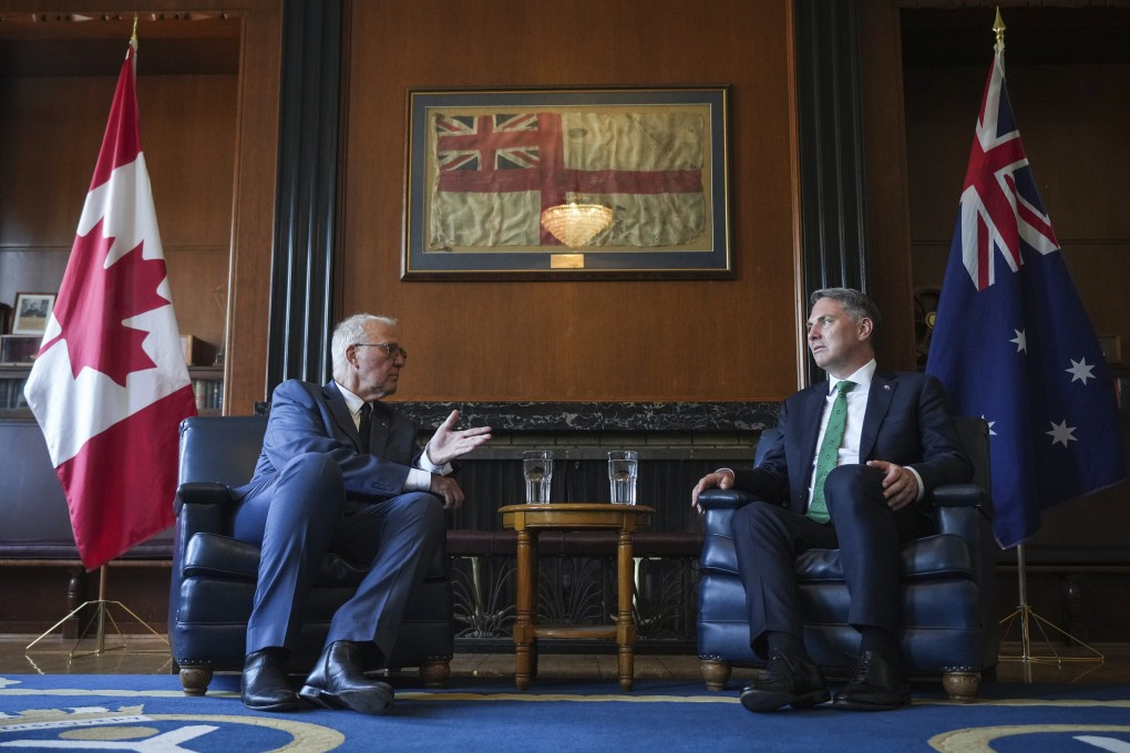 Canada’s Minister of National Defence Bill Blair (left) speaks to Australian Defence Minister Richard Marles in Vancouver on August 8. Photo: The Canadian Press via AP