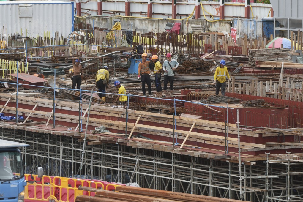 Construction workers at a site in Central. The city’s construction sector is facing cash flow shortages amid a downturn in the property sector. Photo: Sam Tsang
