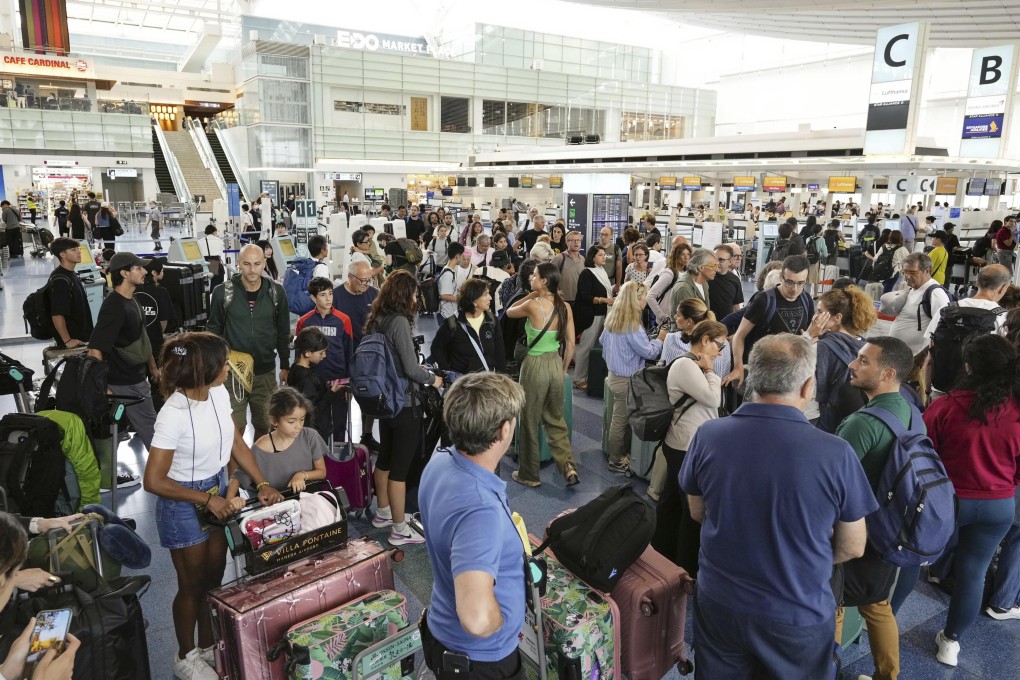 Passengers at Haneda airport in Tokyo on Friday. Photo: Kyodo News via AP