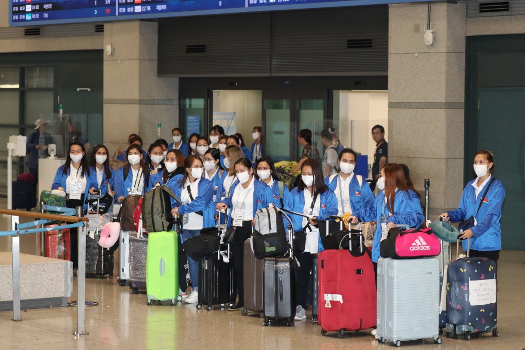 A group of 100 Filipino women, who will work as caregivers in South Korea under  a pilot programme, arrive at Incheon International Airport earlier this month. Photo: EPA-EFE