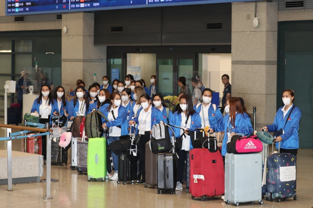 A group of 100 Filipino women, who will work as caregivers in South Korea under a pilot programme, arrive at Incheon International Airport earlier this month. Photo: EPA-EFE