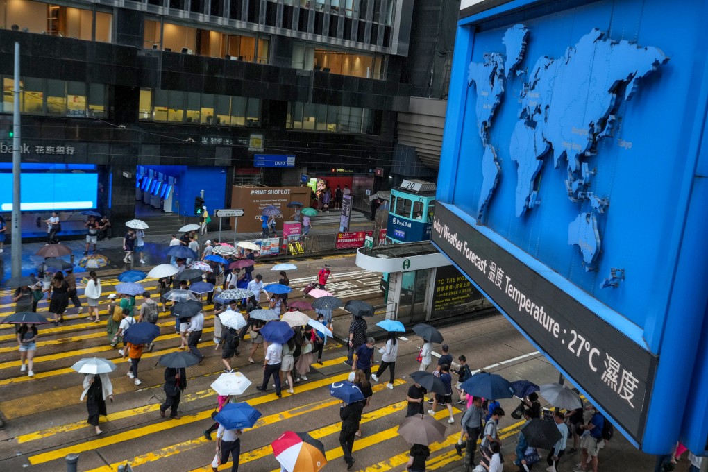Pedestrians cross a street in Central on August 15, 2024. Photo: May Tse