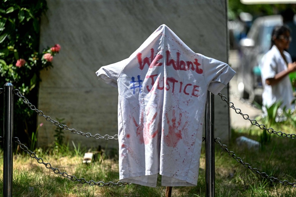 A laboratory coat covered with ink marks depicting blood is seen during a silent protest by resident doctors against the rape and murder of their colleague in India’s West Bengal state on August 17. Photo: AFP