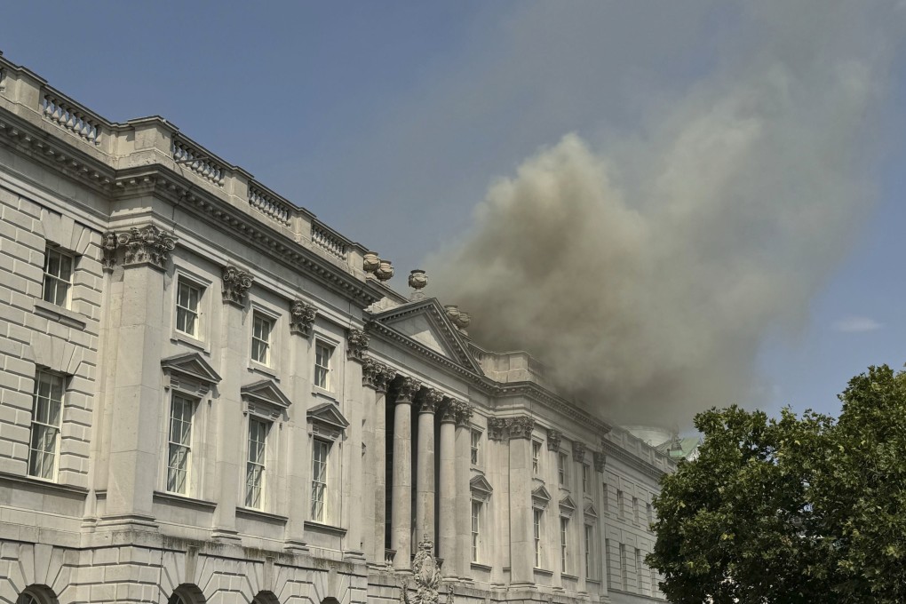 Smoke billows from the roof of Somerset House in central London on Saturday. Photo: PA via AP