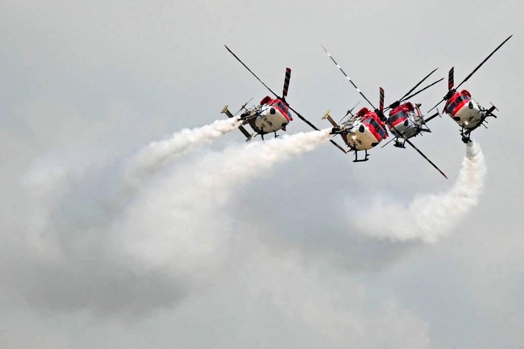 Sarang helicopter display team of the Indian air force perform during Tarang Shakti 2024, an international air exercise at the Sulur air force station in Coimbatore on August 13. Photo: AFP