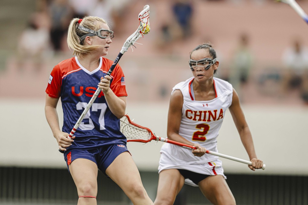 China’s Sara Junlan Curley (right) battles for the ball with Ally Reilly. Photo: Hong Kong, China Lacrosse Association