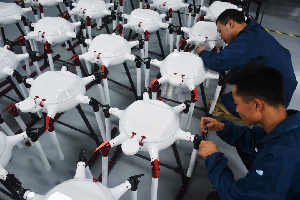 Employees work on the production line for drones at a workshop in Anqing, Anhui province. Photo: Reuters
