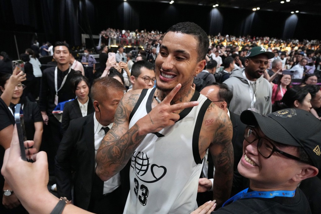 NBA star Kyle Kuzma takes a selfie with a fan at the 12th Yao Foundation Charity Game at Asia World-Expo. Photo: Eugene Lee