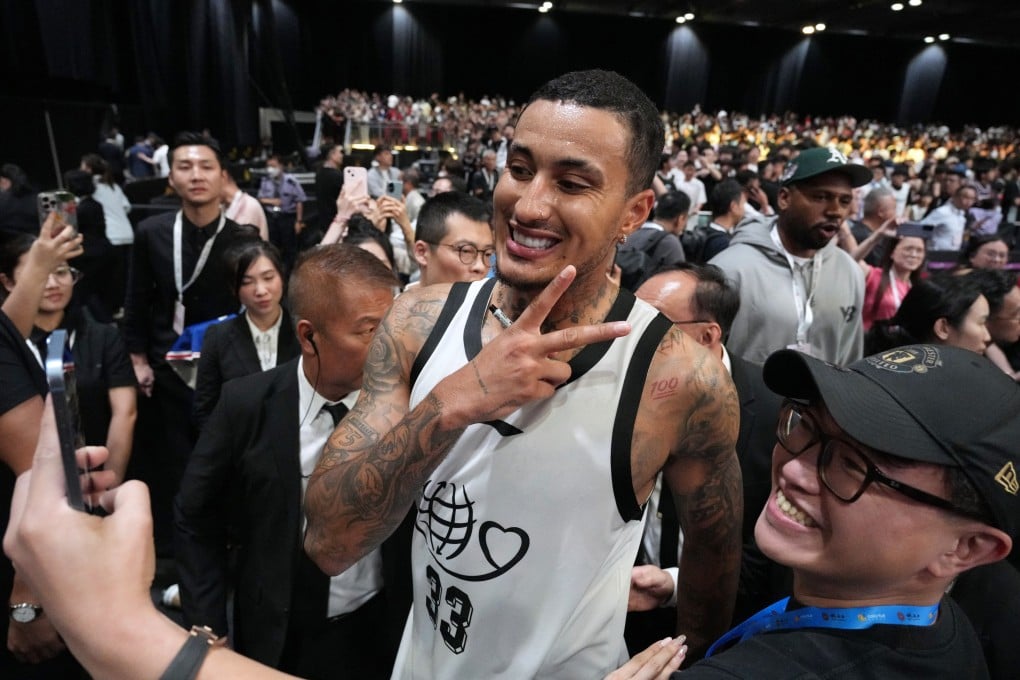 NBA star Kyle Kuzma takes a selfie with a fan at the 12th Yao Foundation Charity Game at Asia World-Expo. Photo: Eugene Lee