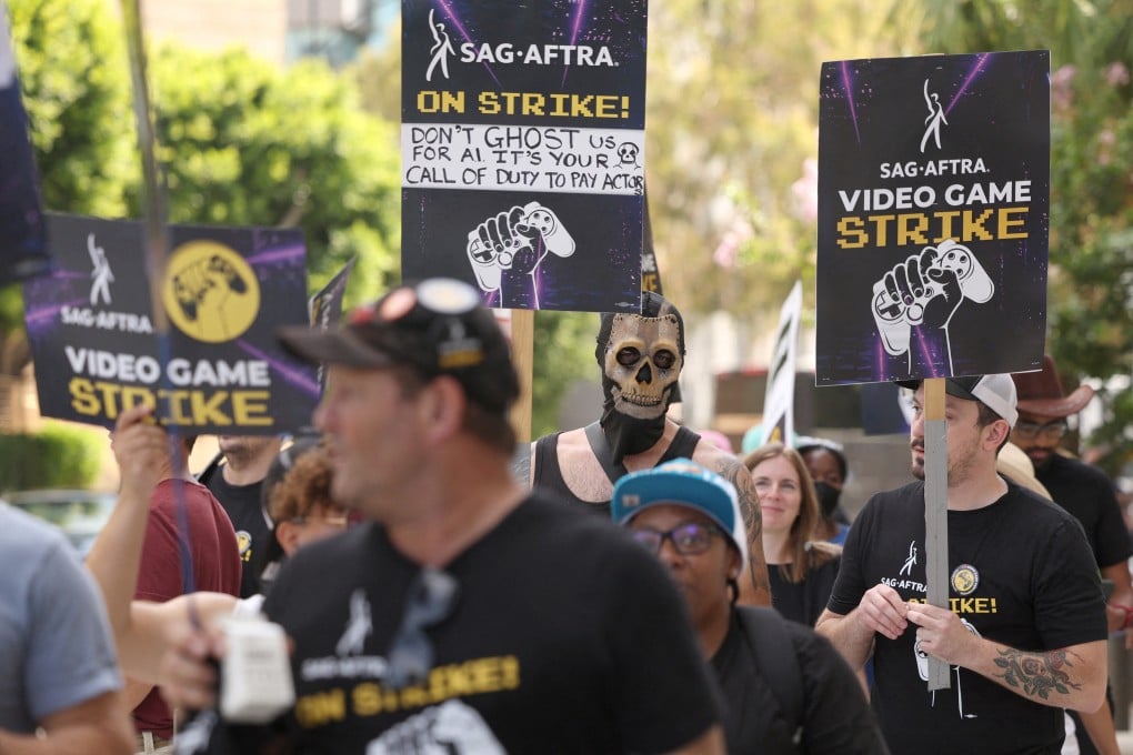 Video-game actors and activists hold signs during the the SAG-AFTRA video game strike kick-off picket outside Warner Bros. Games in Burbank, California, US, on August 1, 2024. Actors, especially those who work in motion capture, fear AI will affect job opportunities in the video game industry. Photo: Reuters