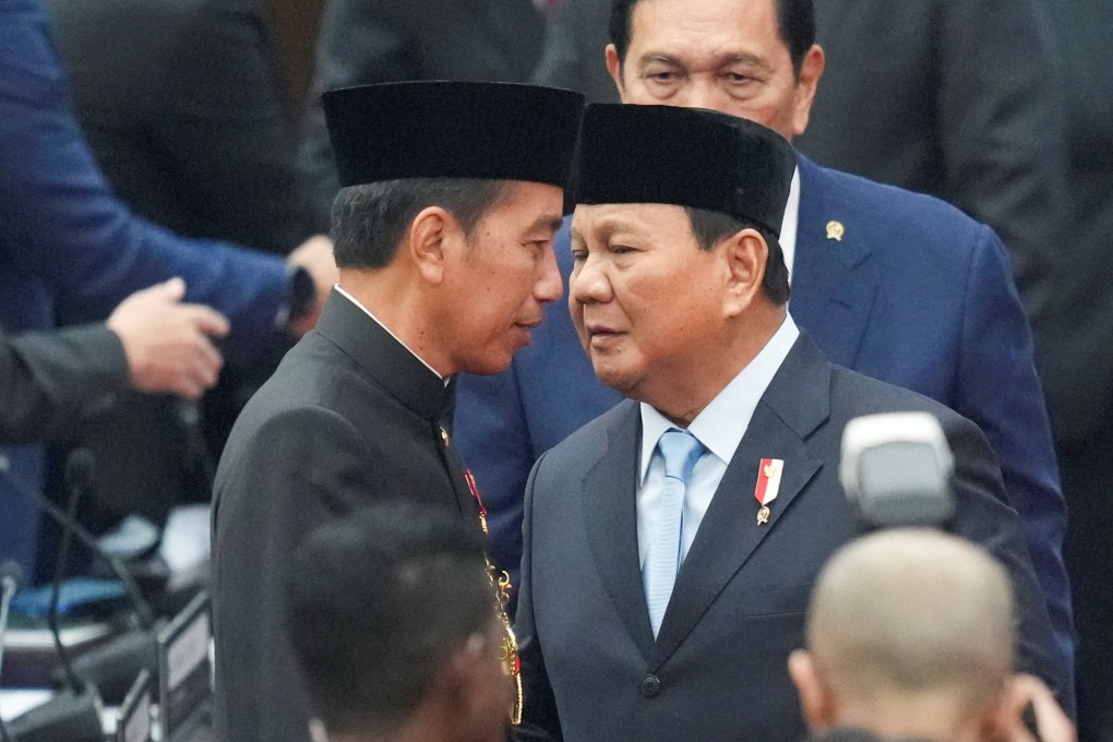 Indonesian President Joko Widodo (left) speaks to president-elect Prabowo Subianto after delivering his annual State of the Nation Address. Photo: Reuters