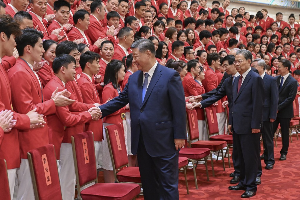 Party and state leaders Xi Jinping, Zhao Leji, Wang Huning, Cai Qi, Li Xi and Han Zheng meet with China’s Olympic delegation at the Great Hall of the People in Beijing. Photo: Xinhua