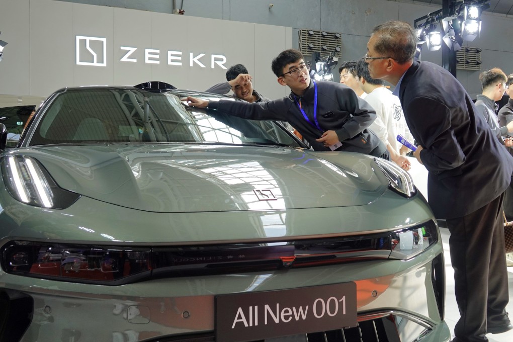 Visitors learn about a Zeekr 001 at the Spring Auto Show in Yantai, China, on April 14, 2024. Photo: Getty Images