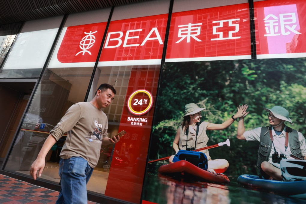 A man walks by a Bank of East Asia branch in Central on February 21, 2024. Photo: May Tse