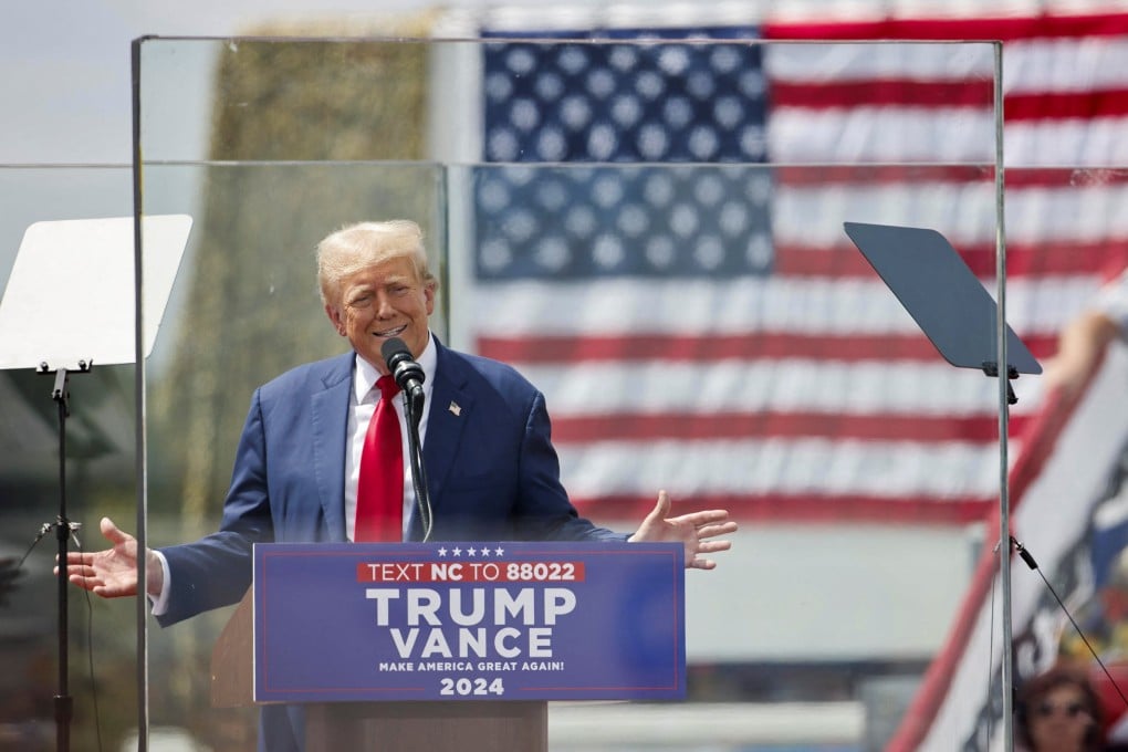 Republican US presidential nominee Donald Trump speaks from behind panes of bulletproof glass in Asheboro, North Carolina, on Wednesday. Photo: Reuters
