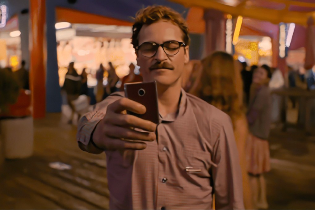 Joaquin Phoenix in a still from Her (2013). More people are turning to AI for girlfriend or boyfriend stand-ins as the tech behind romantic chatbot apps improves, but they risk losing the skills vital for real-life communication and dating.