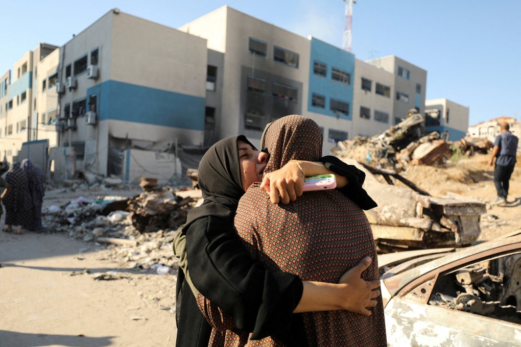 Palestinians react after a school sheltering displaced people was hit by an Israeli strike in Gaza City on Wednesday. Photo: Reuters