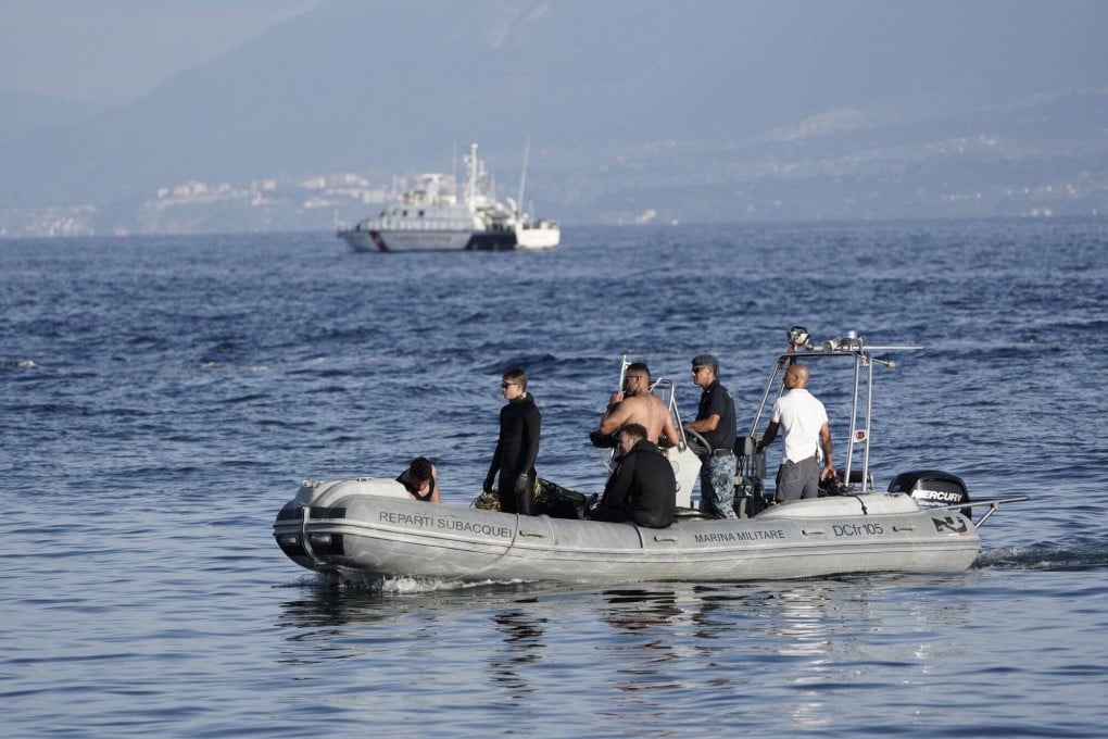 Divers aboard a rib during search operations at the site where luxury yacht Bayesian sank, off the coast of Porticello. Photo: Bloomberg
