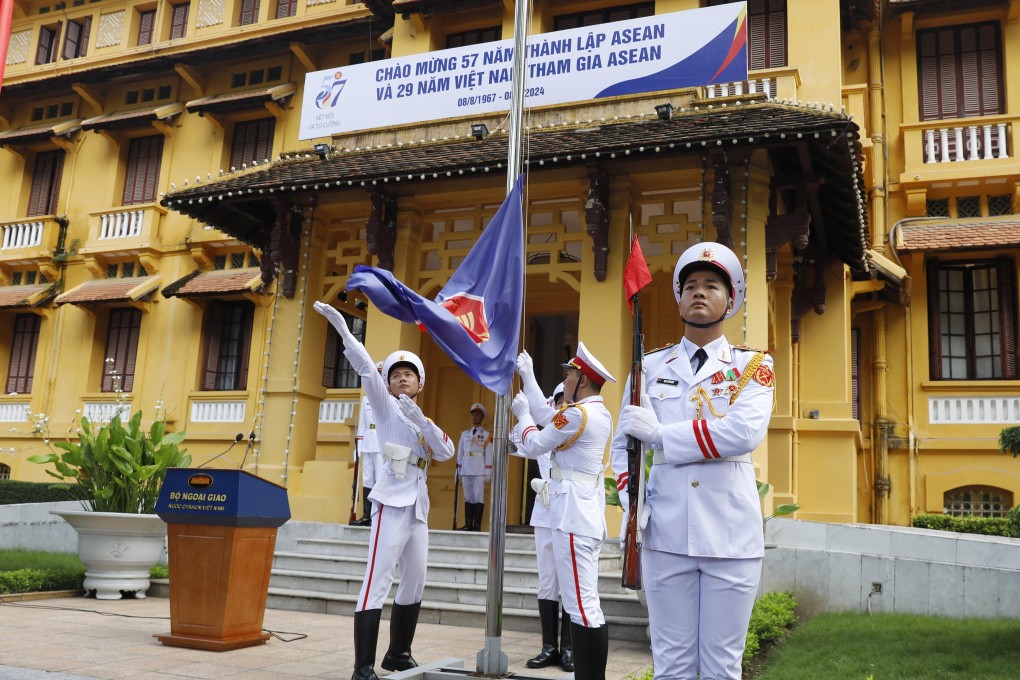 An honour guard raises an Asean flag outside the foreign ministry in Hanoi on August 8 to mark the 29th anniversary of Vietnam’s accession to the bloc. Photo: EPA-EFE