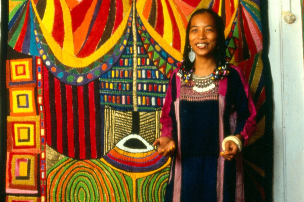 Pacita Abad in 1986 with her work Bacongo I (1983). The Filipino fabric artist’s work uplifted underrepresented communities around the world but until recently was rejected by the mainstream art world. Photo: courtesy Pacita Abad Art Estate