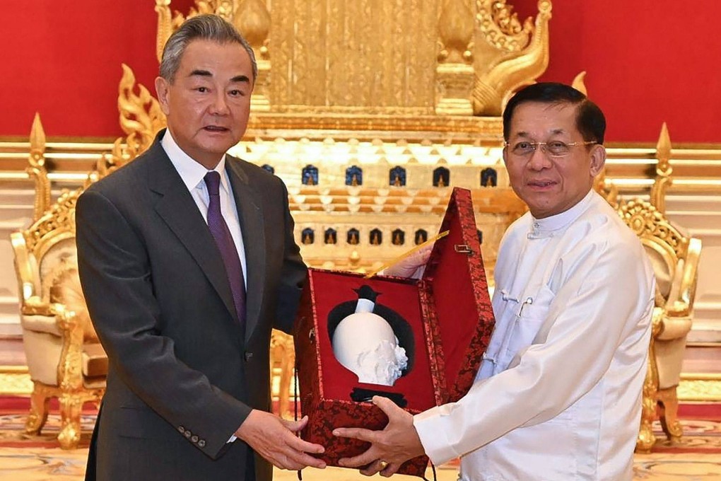 Myanmar’s junta chief Min Aung Hlaing (right) meets China’s Foreign Minister Wang Yi in Naypyidaw on August 14. Photo: Myanmar Military Information Team/AFP