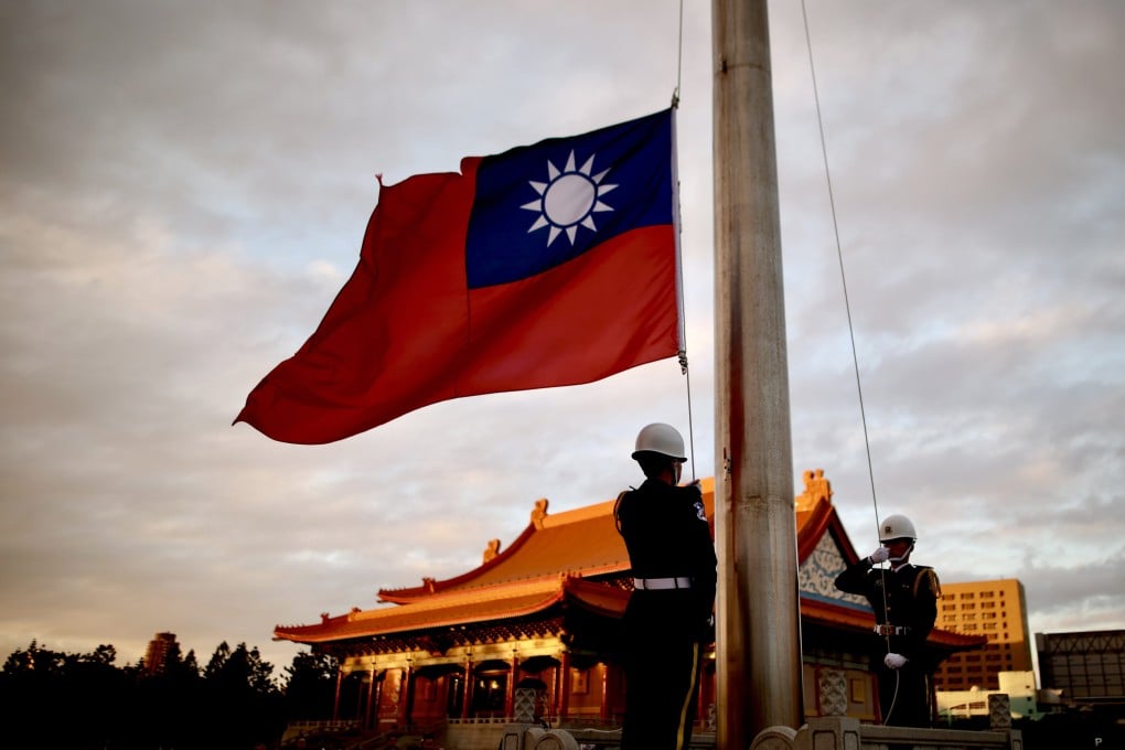Honor guards lower the flag of Taiwan in Taipei. Beijing emphasised its zero tolerance for the island’s independence this week at a high-level Hong Kong conference. Photo: EPA-EFE