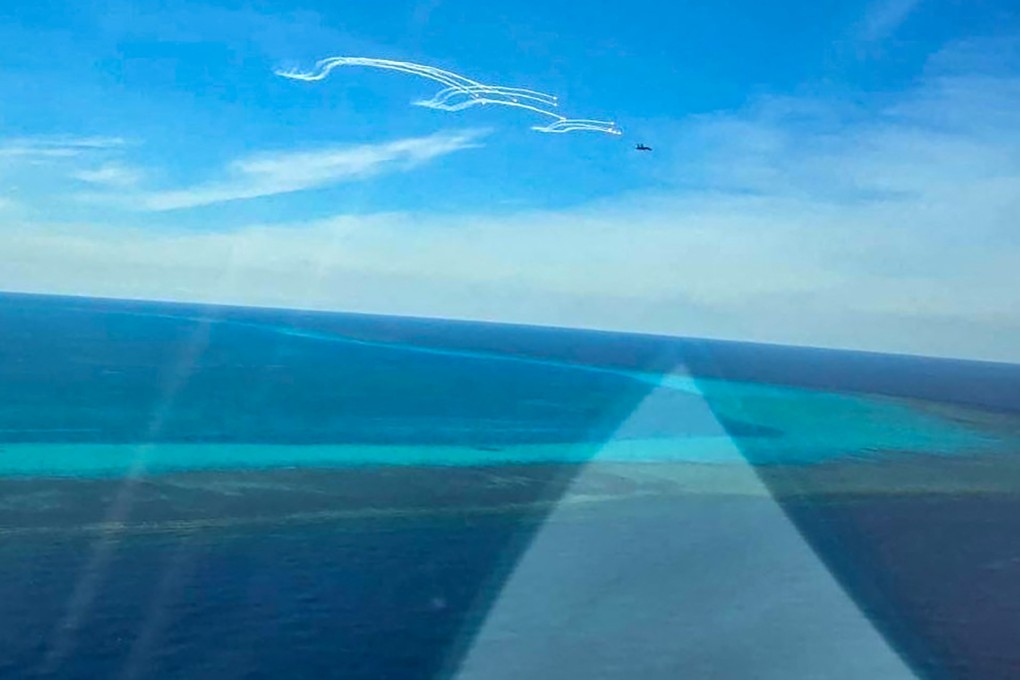 Manila says a Chinese fighter jet deployed flares near a Philippine fisheries bureau patrol plane close to Scarborough Shoal in the South China Sea. Photo: AFP / Philippine Coast Guard (PCG)
