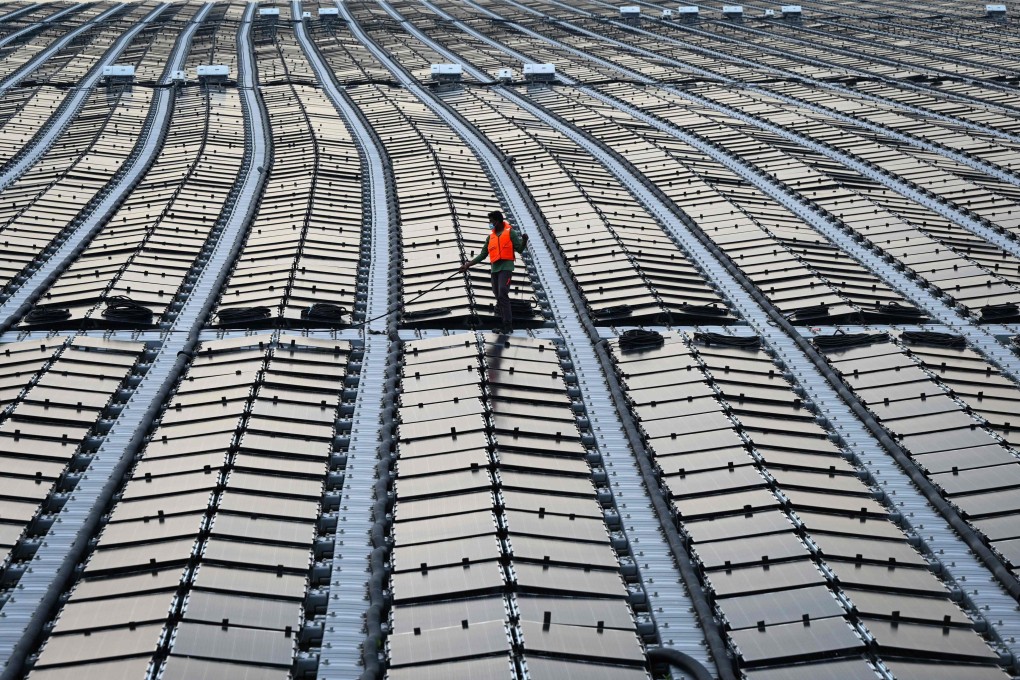 A worker on a floating solar power farm off Singapore’s northern coast. Photo: AFP