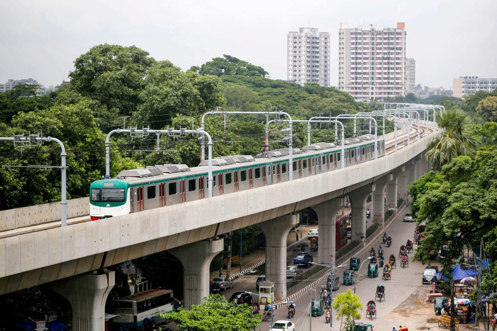 A metro train rides along a transit line in Dhaka on Sunday. Photo: AFP