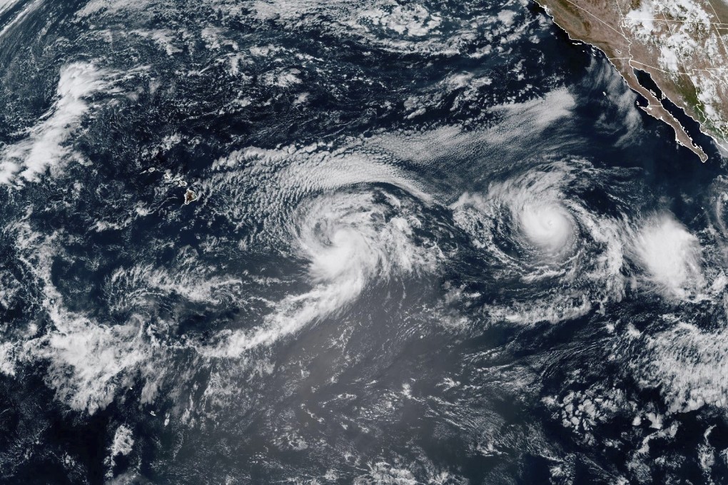 A satellite image provided by the National Oceanic and Atmospheric Administration (NOAA) shows Hurricane Gilma and Tropical Storm Hone, located west-southwest of the southern tip of the Baja California peninsula of Mexico near the top right corner, on Thursday. Photo: NOAA via AP