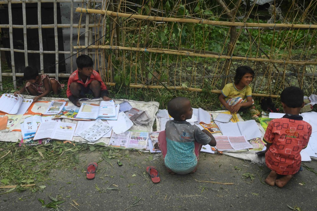 Children lay out their wet textbooks to dry after Cyclone Amphan made landfall on Khejuri in India’s eastern state of West Bengal in May 2020. The Bay of Bengal nations could unlock their educational and economic potential through effective Sino-Indian collaboration. Photo: AFP