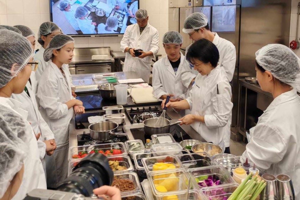 Samantha Tam (second from right) teaches a class at Hong Kong Polytechnic University’s School of Hotel and Tourism Management. She hopes her students start out with an interest in food, but assumes she is working with a blank slate. Photo: Polytechnic University