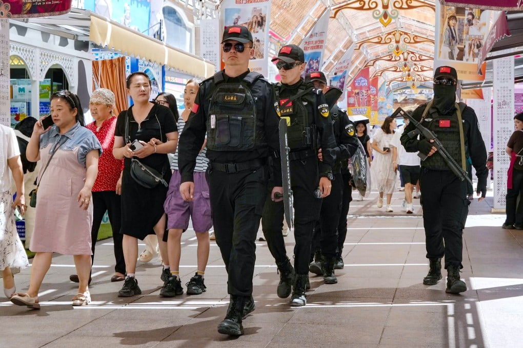 Armed police officers patrol at the Grand Bazaar in Urumqi, Xinjiang on July 5, the 15th anniversary of deadly riots in the city caused by ethnic unrest. Photo: Kyodo
