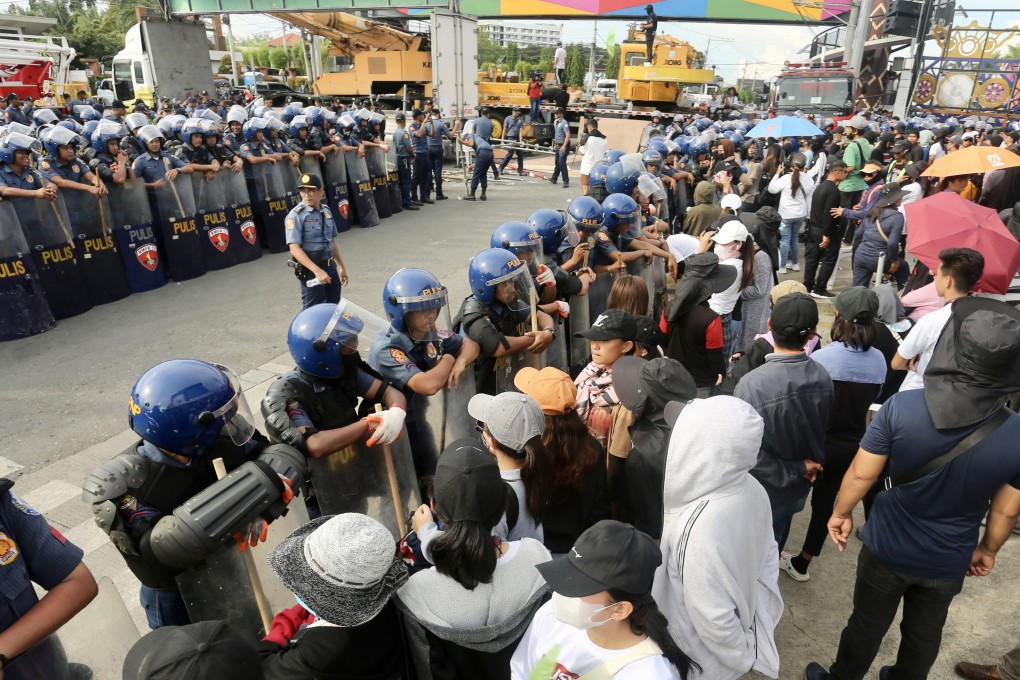 Supporters of religious leader Apollo Quiboloy protest outside the Kingdom of Jesus Christ compound in Davao City on Monday. Photo: EPA-EFE