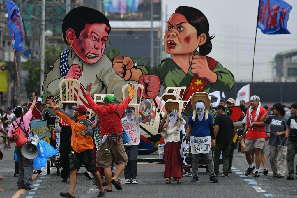 Effigies of Philippine President Ferdinand Marcos Jnr and Vice-President Sara Duterte are seen as protesters march to Congress during a demonstration coinciding with Marcos’ State of the Nation Address in Manila on July 22. Photo: AFP