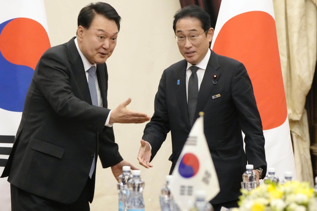 Japanese PM Fumio Kishida and South Korean President Yoon Suk-yeol meet in Lithuania last year. Photo: Kyodo