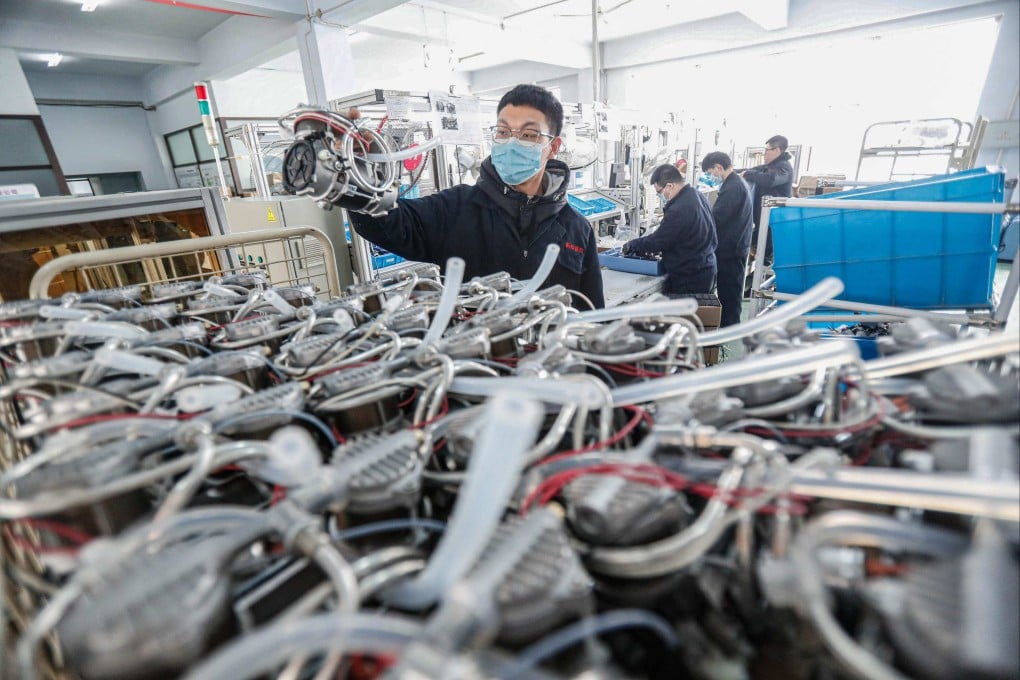 An employees working on a ventilator production line in a workshop of a medical company in Shenyang, in northeastern China’s Liaoning province. Photo: AFP