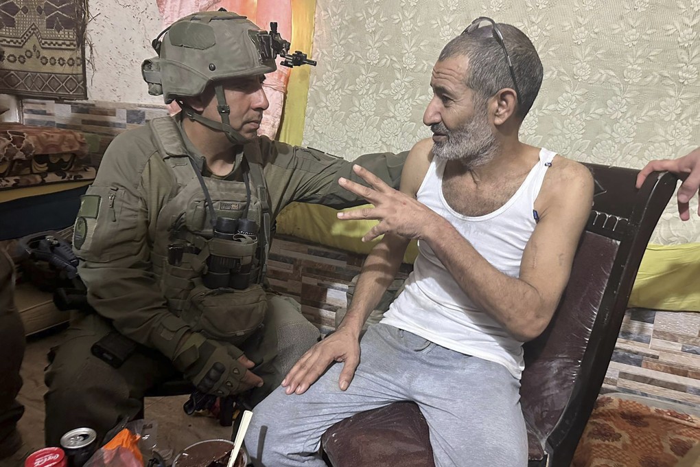 Qaid Farhan Alkadi, right, and Brigadier General Itzik Cohen talk after his rescue. Photo: Israeli Defence Forces via AP