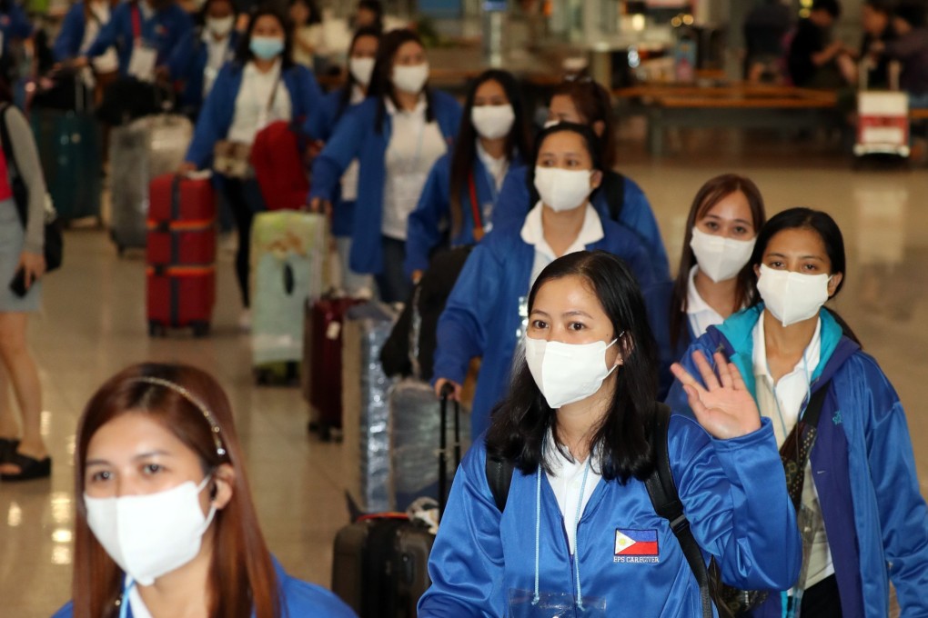 A group of 100 Filipino women arrive in Seoul on August 6 to take part in South Korea’s first-ever pilot project for domestic workers from the country. Photo: Yonhap/EPA-EFE