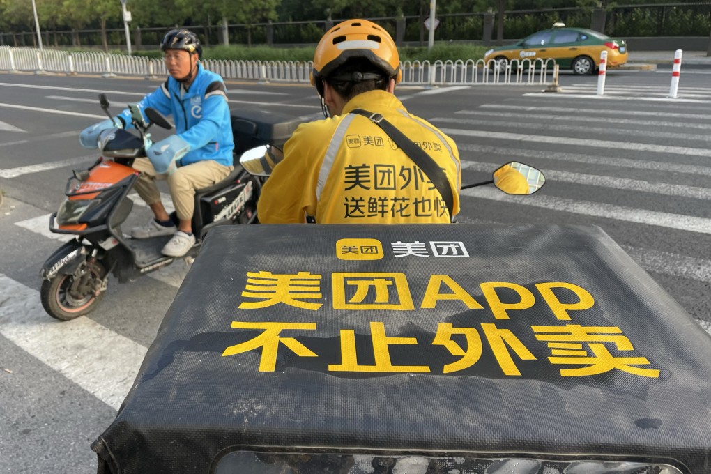 A food delivery courier for Meituan waits on the side of the road in Beijing, September 1, 2023. Photo: Simon Song