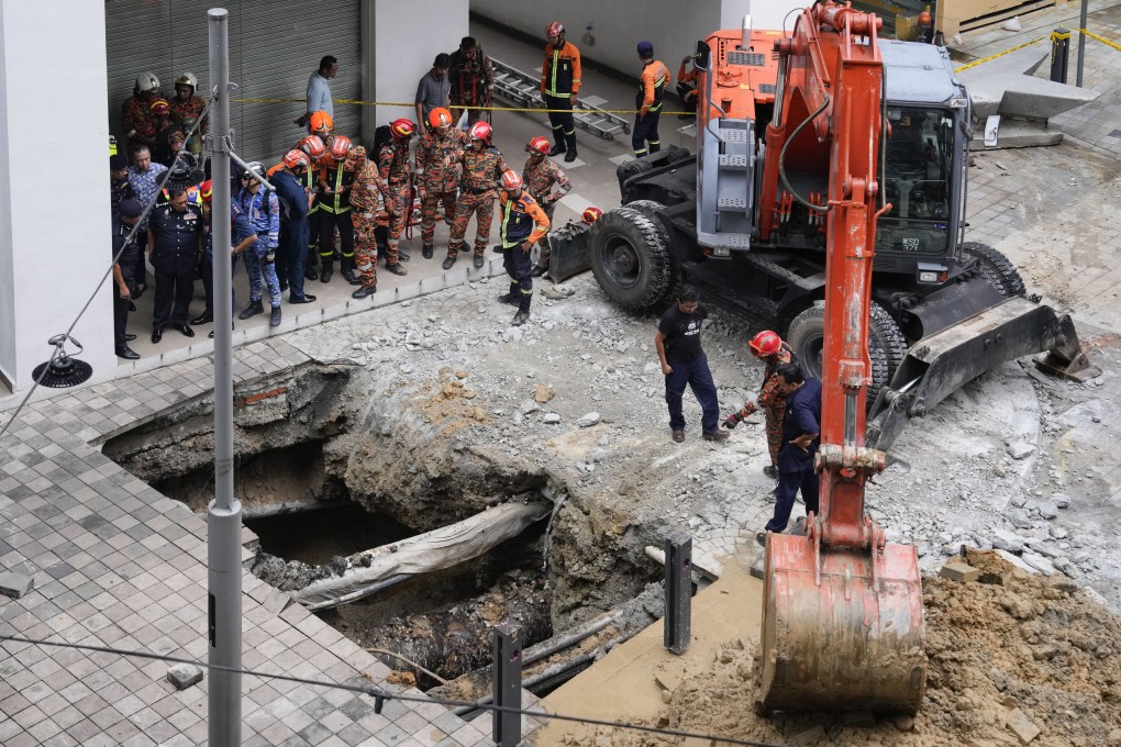 A 48-year-old Indian tourist has yet to be found after falling into a sinkhole in Kuala Lumpur on Friday. Photo: AP