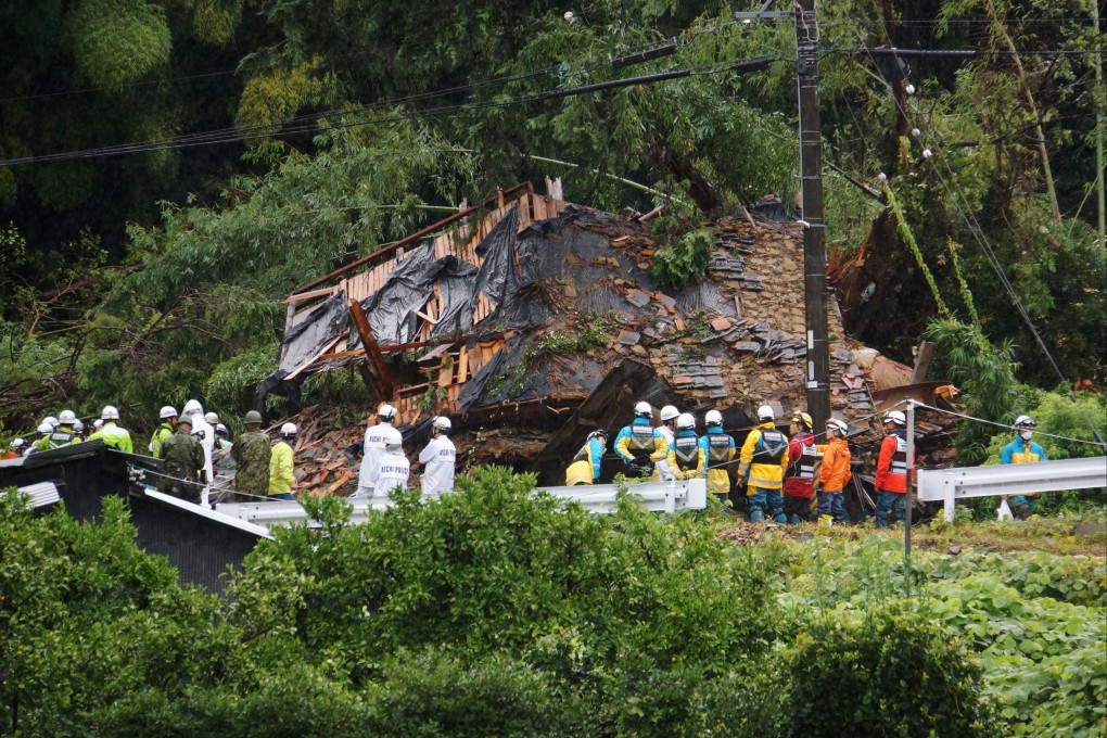 Rescuers search for missing residents living at a house in Japan’s Aichi prefecture that collapsed on Wednesday due to heavy rain triggered by Typhoon Yanyan. Photo: Jiji Press/EPA-EFE