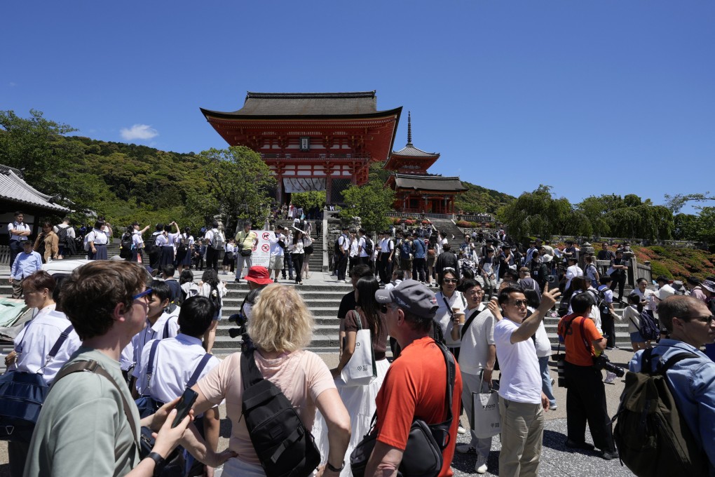 Tourists at Kiyomizu-dera temple in Kyoto, where authorities have banned visitors from entering certain streets. With global tourism on track to break records in 2024, residents of some of the world’s most visited places are being left disgruntled as the crowds bring problems. Photo: EPA-EFE