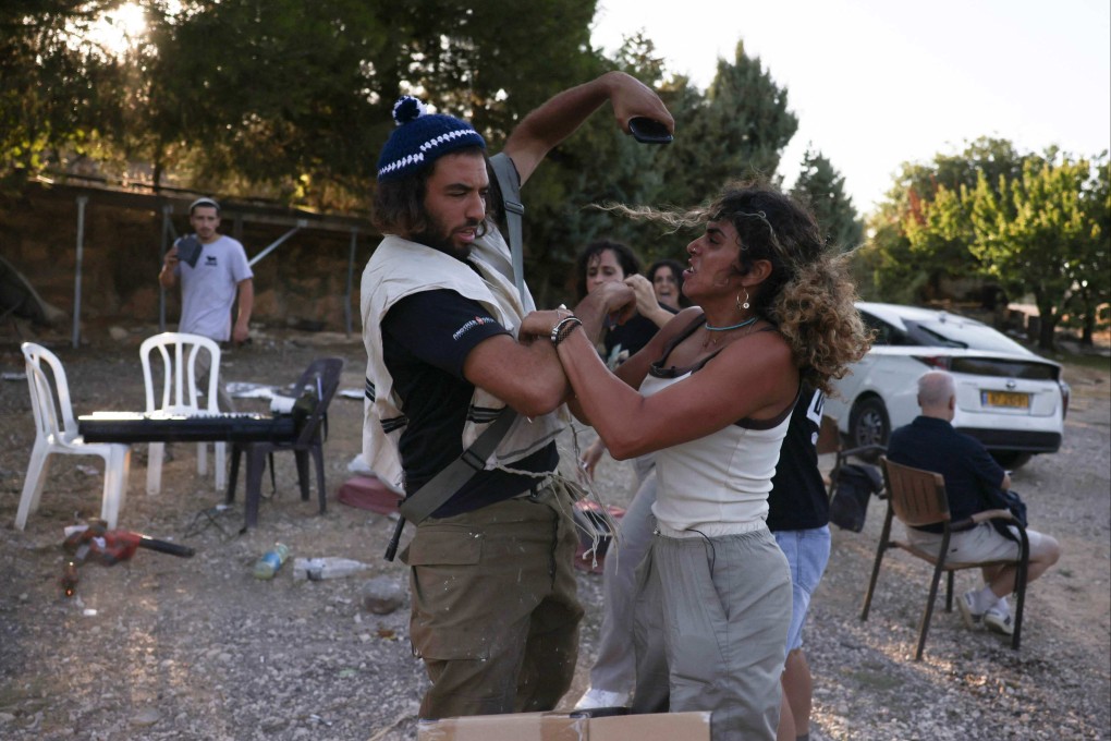 Activists confront settlers on land in al-Makhrour in the occupied West Bank near Beit Jala village on August 22. Photo: AFP