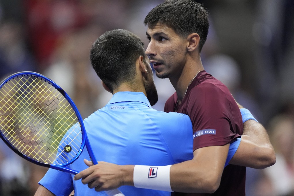 Novak Djokovic embraces Alexei Popyrin after the defending US Open champion’s shock defeat in the third round. Photo: Reuters