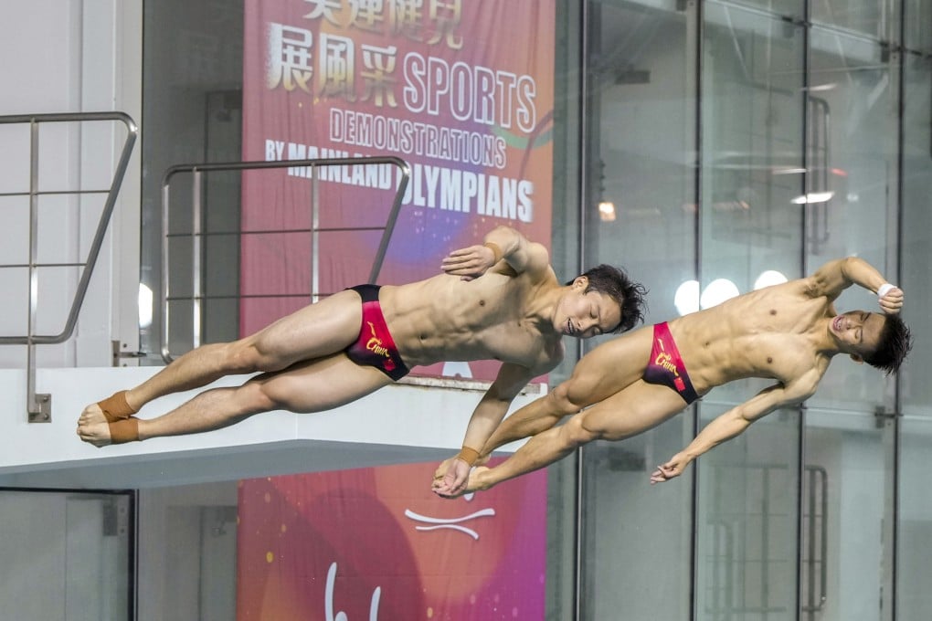 Divers Wang Zongyuan (left) and Long Daoyi showcase their skills at a public event in Hong Kong on Saturday. Photo: Sam Tsang