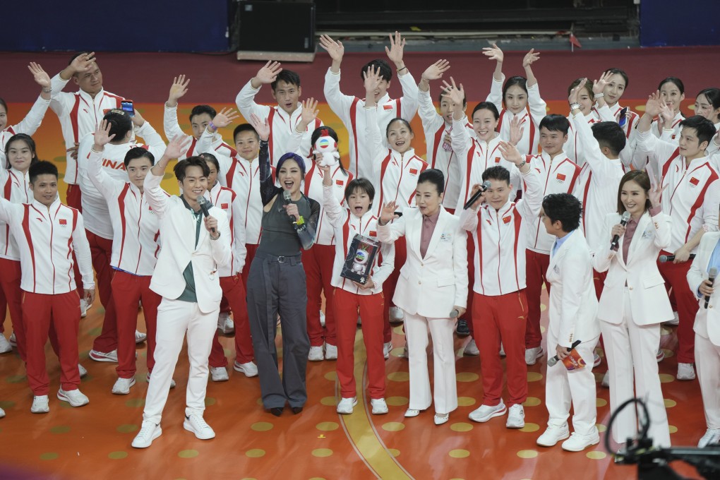 Mainland Olympians greet  fans at Queen Elizabeth Stadium in Causeway Bay on Friday evening. Photo: Eugene Lee