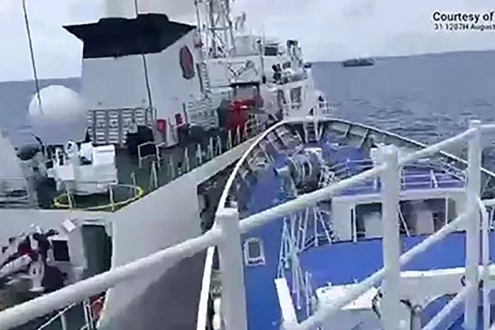 Chinese and Philippine coastguard vessels confront each other near Sabina Shoal on Sunday. Photo: AFP