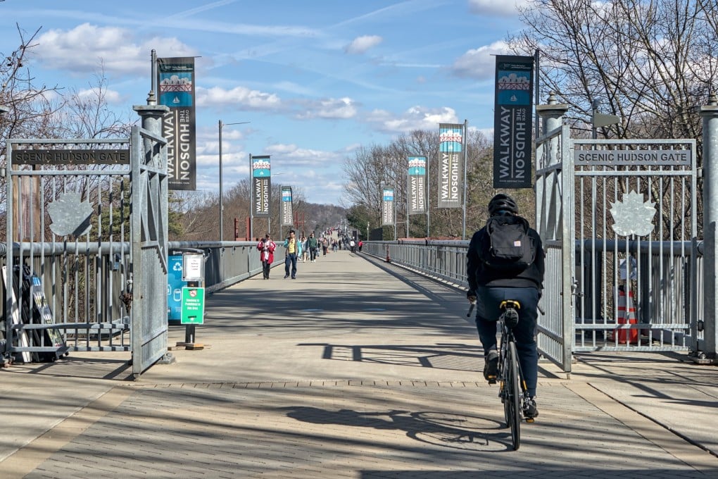 Cyclists and pedestrians take the Walkway Over the Hudson bike path, part of the Empire State Trail, in upstate New York. Photo: Shutterstock