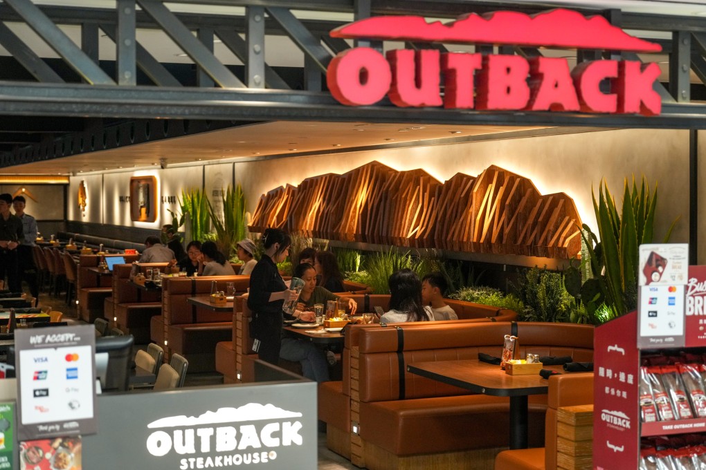 Diners at Outback Steakhouse in Tsim Sha Tsui on July 29. The restaurant chain announced that it would cease operations at nine of its branches in Hong Kong on August 4. Photo: Sam Tsang